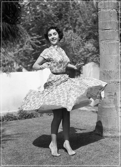 “Elizabeth Taylor Twirling On Lawn” by Frank Worth