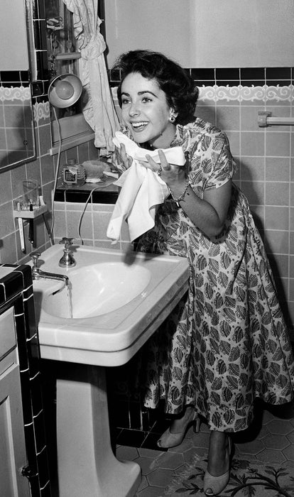 “Elizabeth Taylor Washing Face” by Frank Worth