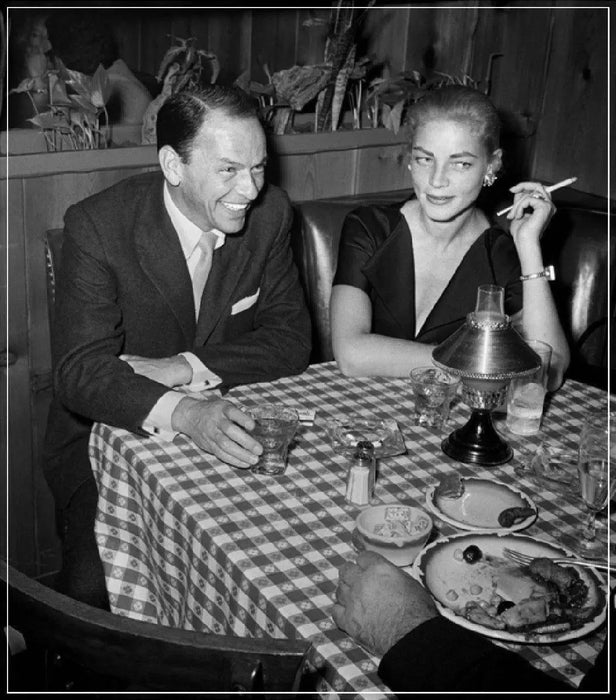 “Frank Sinatra And Lauren Bacall At Dinner” by Frank Worth