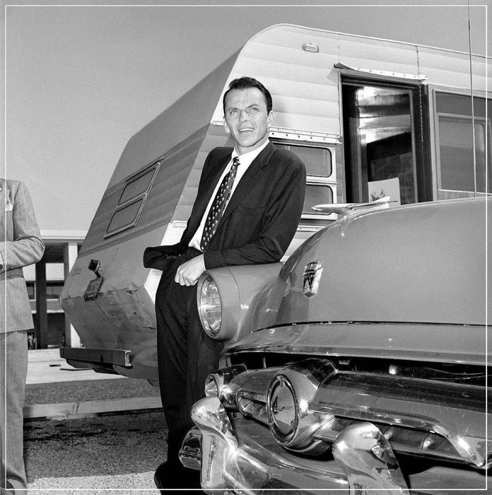 “Frank Sinatra Outside Trailer, Leaning On Car” by Frank Worth