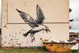 Seagull Raiding A Dumpster by Banksy's Graffiti