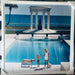 "Nice Pool" 50x50 Framed C-print by Slim Aarons