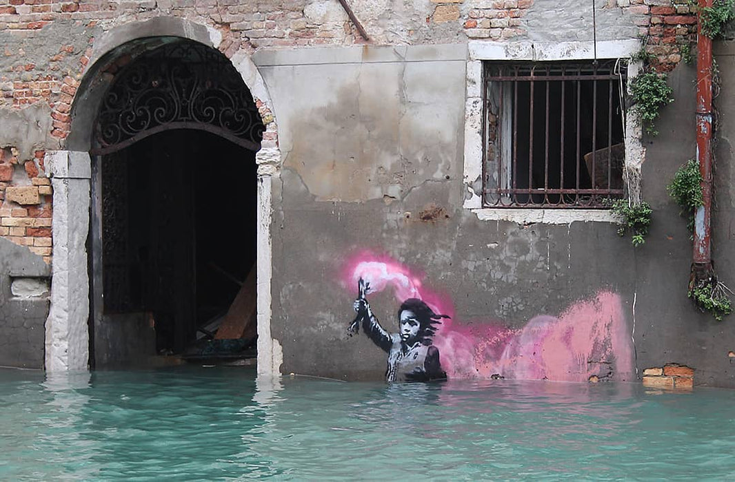 The Migrant Child by Banksy's Graffiti