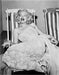 “Marilyn Monroe In Deckchair” by Frank Worth