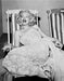 “Marilyn Monroe In Deckchair” by Frank Worth