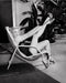 “Marilyn Monroe Tying Shoe By Pool” by Frank Worth